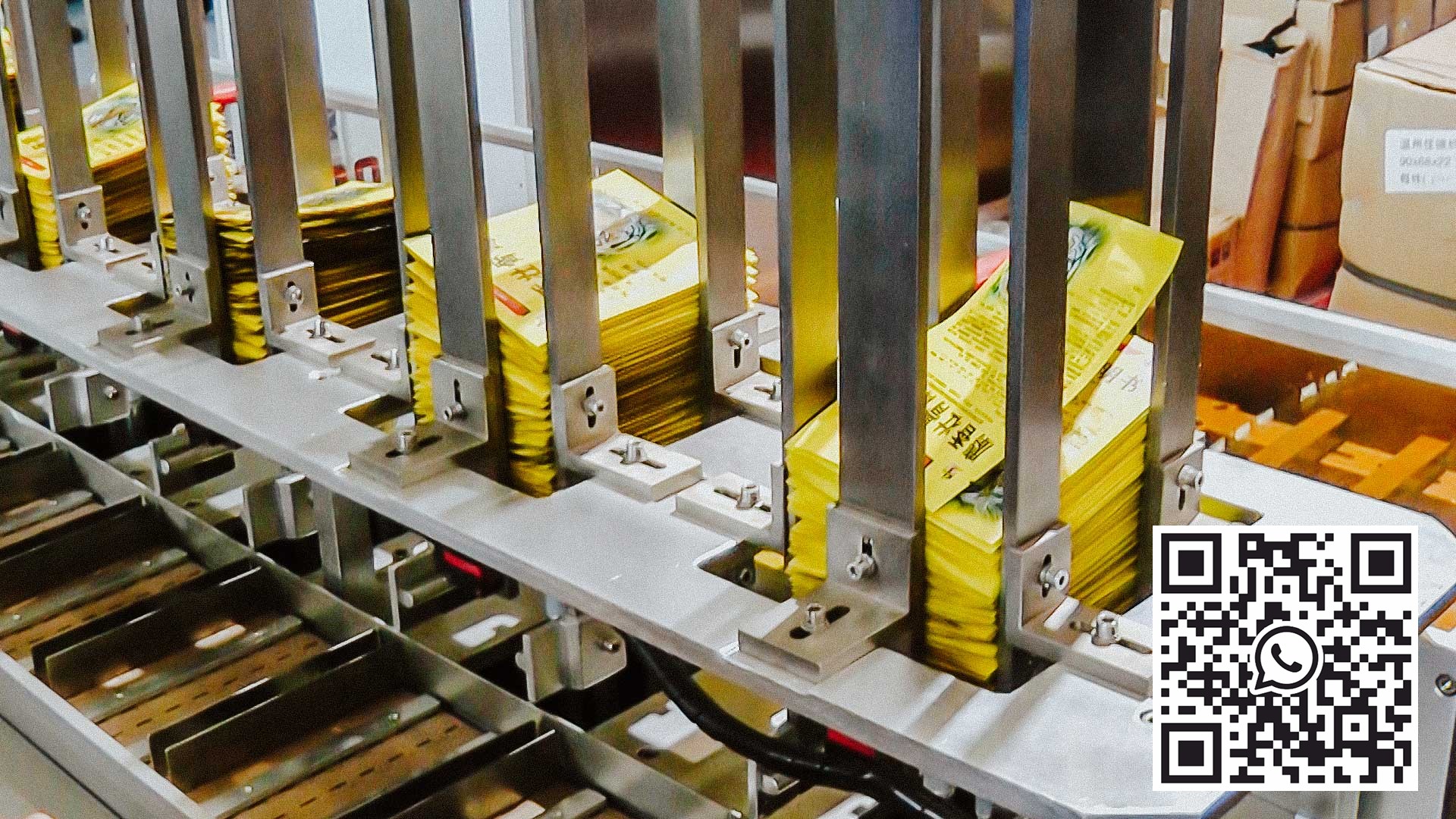 Automatinė kartoninė įranga, skirta grupiniam produktų pakavimui į dėžes