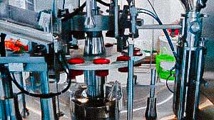 Automatic equipment for dosing and filling of plastic tubes with cream