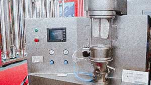 Automatic fluidized bed granulator for tablet protective coating