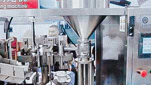 Automatic machine for filling and sealing the cream dosage into plastic tubes USA