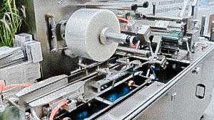 Automatic packaging in cellophane wrap cardboard boxes with medicine