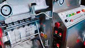 Automatic packaging machine for group packaging of tablets in soft cell packaging