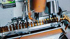 Compact model of pharmaceutical bottling and capping equipment glass vial