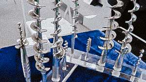 Spare parts auger for powder dispenser pharmaceutical drug production