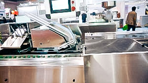 Automatic equipment for blister packaging in carton boxes