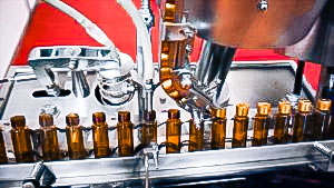 Automatic equipment for filling and capping penicillin bottles