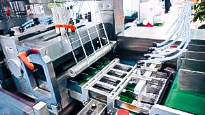 Automatic equipment for packing in cellophane film of medical boxes