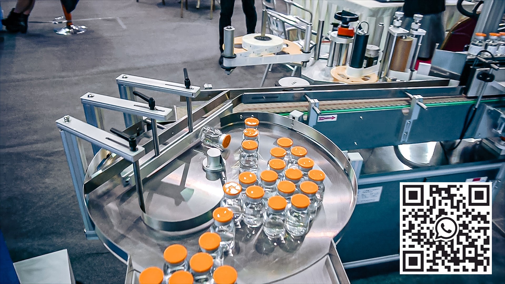 Automatic equipment for sticking self-adhesive labels on the glass bottles