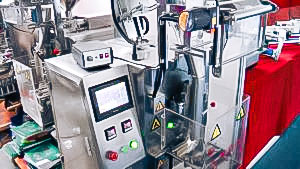 Automatic equipment for packing of products into sashet packs in pharmaceutical production